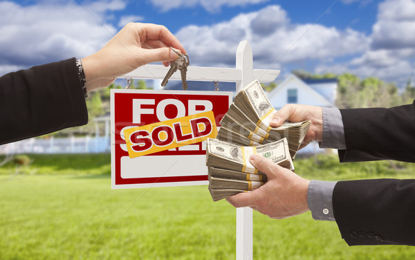 Handing Over Cash for Keys in Front of House, Sign Stock photo © feverpitch