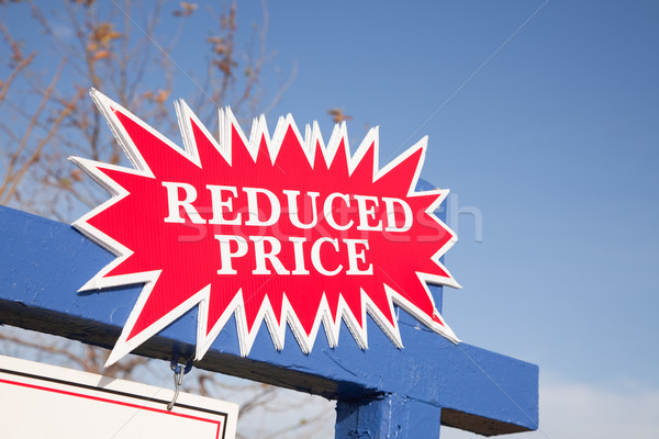 Red Reduced Price Burst Sign Stock photo © feverpitch