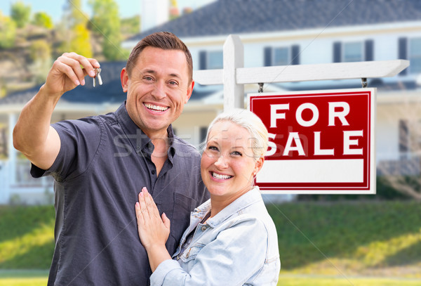 Young Adult Couple With House Keys In Front of Home and For Sale Stock photo © feverpitch