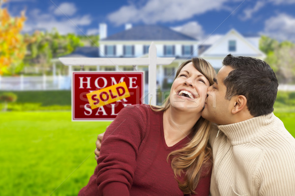 Stock photo: Mixed Race Couple in Front of Sold Real Estate Sign