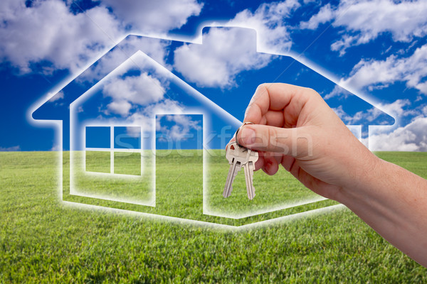Handing Over Keys on Ghosted Home Icon, Grass Field and Sky Stock photo © feverpitch