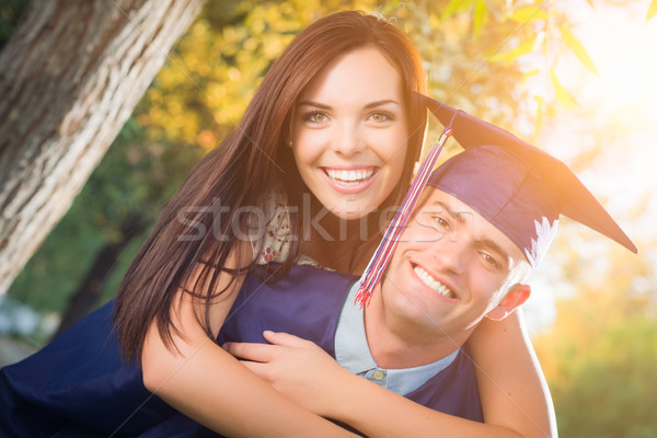 Szczęśliwy mężczyzna absolwent cap suknia dość Zdjęcia stock © feverpitch