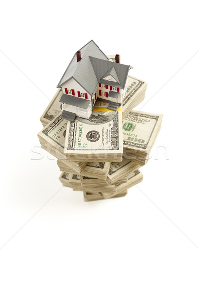 Kicsi ház száz dollár bankjegyek izolált fehér Stock fotó © feverpitch