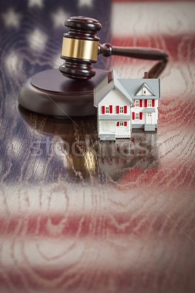 Small House and Gavel on Table with American Flag Reflection Stock photo © feverpitch