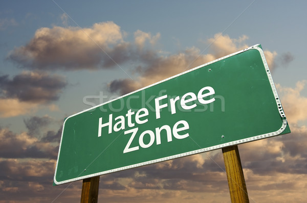 Stock photo: Hate Free Green Road Sign and Clouds