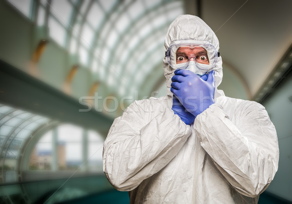 Man Covering Mouth With Hands Wearing HAZMAT Protective Clothing Stock photo © feverpitch