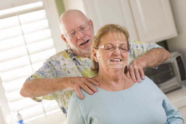 Senior Adult Husband Giving Wife a Shoulder Rub Stock photo © feverpitch