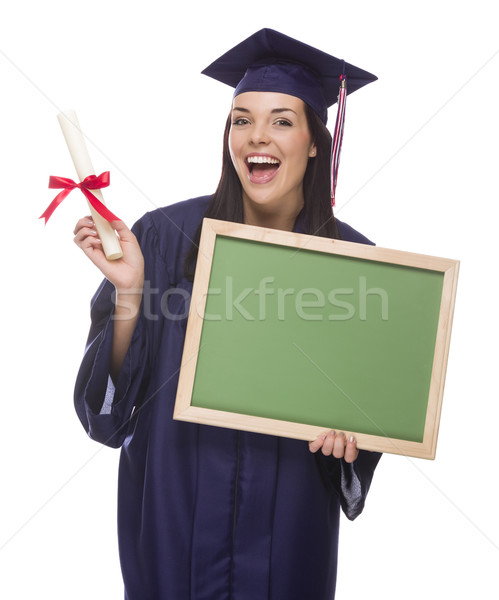 Female Graduate in Cap and Gown Holding Diploma,Blank Chalkboar Stock photo © feverpitch