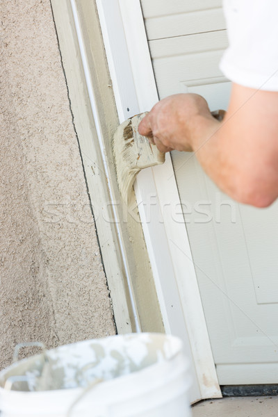 Professional Painter Cutting In With Brush to Paint Garage Door  Stock photo © feverpitch