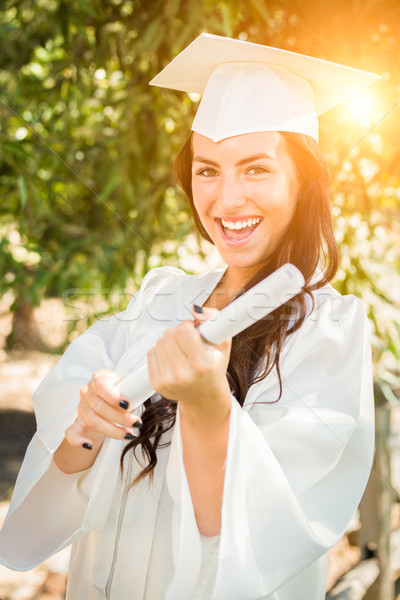 Graduating Mixed Race Girl In Cap and Gown with Diploma Stock photo © feverpitch