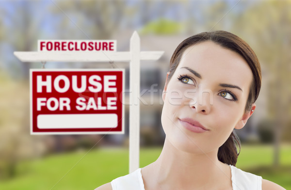 Mixed Race Woman In Front of House and Foreclosure Sign Stock photo © feverpitch