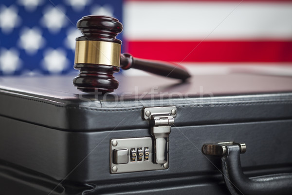 Briefcase and Gavel Resting on Table with American Flag Behind Stock photo © feverpitch