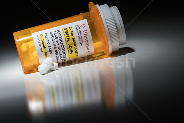 Hydrocodone Pills and Prescription Bottle with Non Proprietary L Stock photo © feverpitch