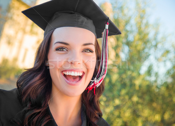 Stock photo: Happy Graduating Mixed Race Woman In Cap and Gown