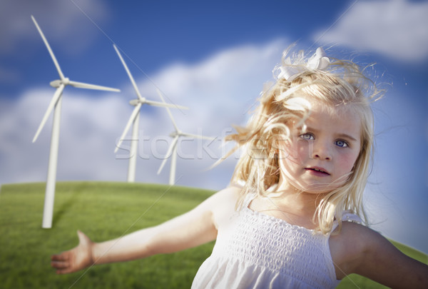 Beautiful Young Girl Playing in Wind Turbine Field Stock photo © feverpitch