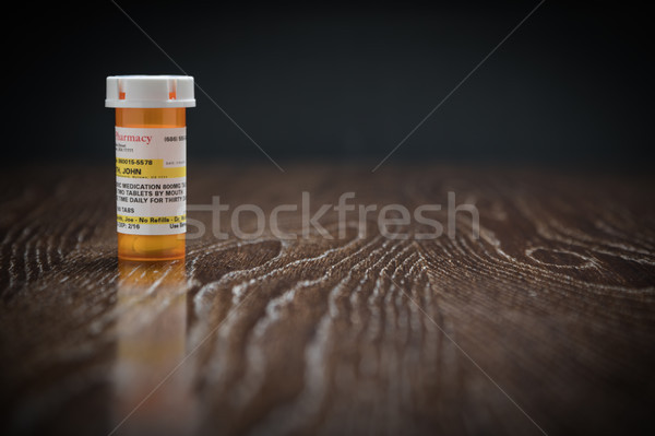 Non-Proprietary Prescription Medicine Bottle on Reflective Woode Stock photo © feverpitch