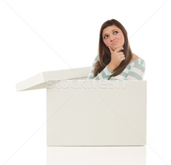 Ethnic Female Popping Out and Thinking Outside The Box Stock photo © feverpitch