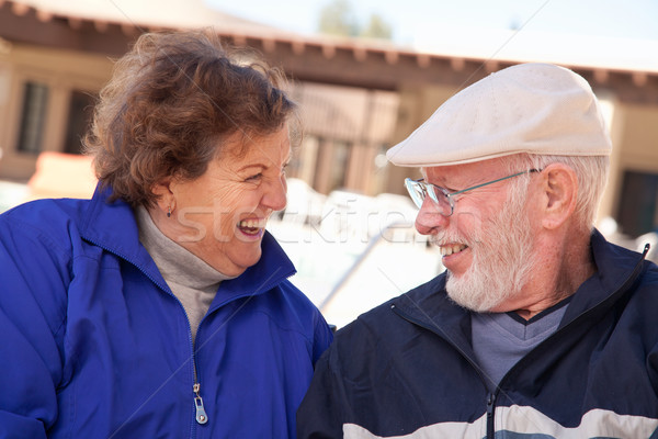 Happy Senior Adult Couple Bundled Up Outdoors Stock photo © feverpitch