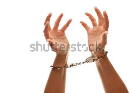 Handcuffed Woman Raising Hands in Air on White Stock photo © feverpitch