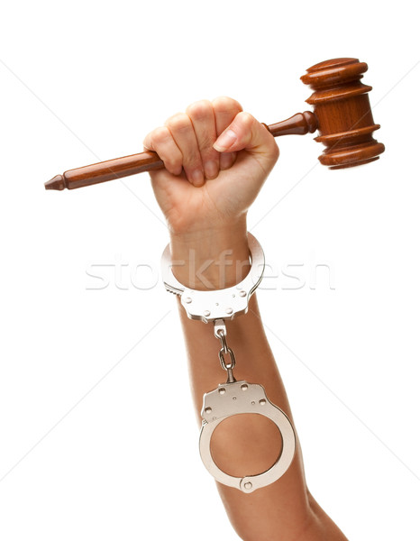 Handcuffed Woman Holding Wooden Gavel on White Stock photo © feverpitch