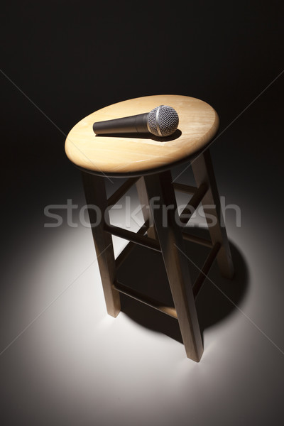 Microphone Laying on Wooden Stool Under Spotlight Stock photo © feverpitch