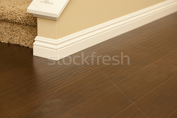 Newly Installed Brown Laminate Flooring and Baseboards in Home Stock photo © feverpitch