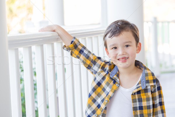 Young Mixed Race Boy on His Front Porch Stock photo © feverpitch