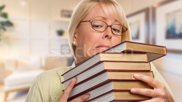 Stock photo: Beautiful Expressive Student or Businesswoman with Books in Offi