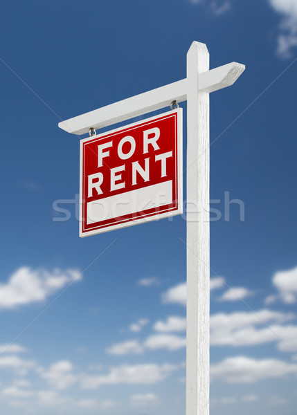 Left Facing For Rent Real Estate Sign on a Blue Sky with Clouds. Stock photo © feverpitch