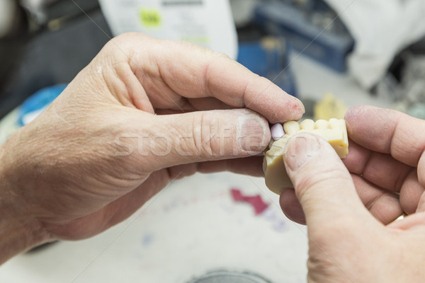 Dental Technician Working On 3D Printed Mold For Tooth Implants Stock photo © feverpitch