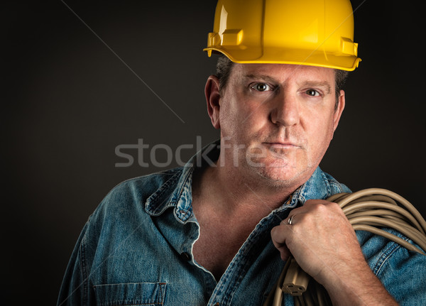 Serious Contractor in Hard Hat Holding Extention Cord With Drama Stock photo © feverpitch