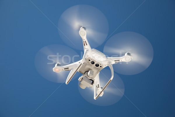 Drone Quadcopter From Below Against A Blue Sky Stock photo © feverpitch