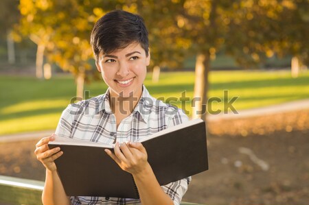 Portrait of a Pretty Mixed Race Female Student Holding Books Stock photo © feverpitch