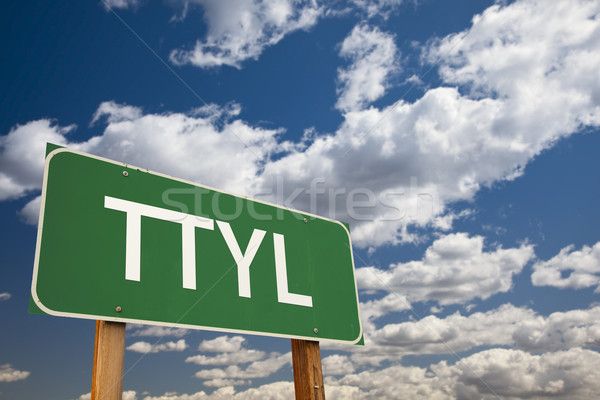 TTYL Green Road Sign Over Sky Stock photo © feverpitch