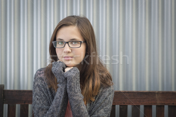 Portré búskomorság fiatal lány szemüveg ül pad Stock fotó © feverpitch