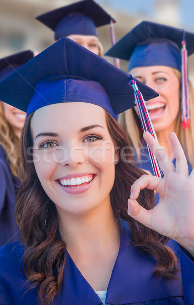 Stock photo: Happy Graduating Group of Girls In Cap and Gown Celebrating on C
