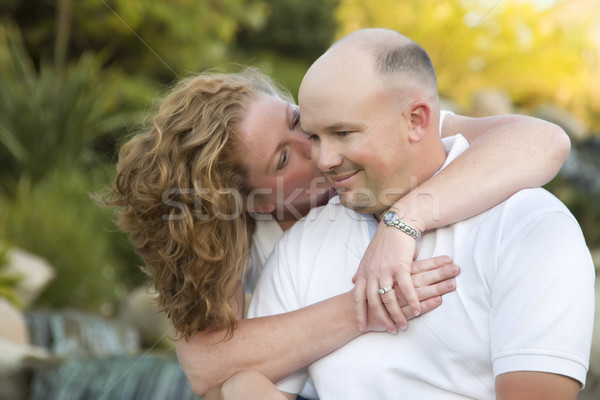привлекательный пару поцелуй щека парка счастливым Сток-фото © feverpitch