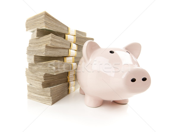 Pink Piggy Bank with Stacks of Money Stock photo © feverpitch