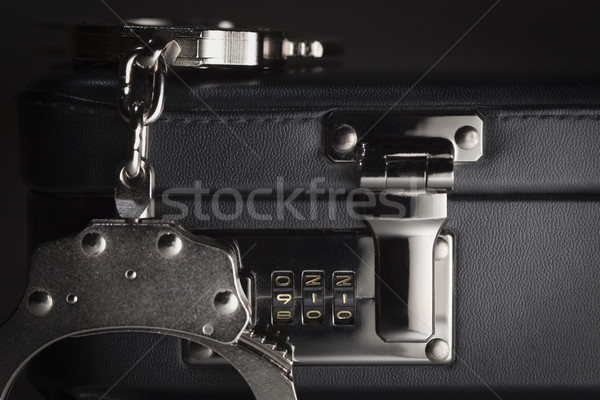 Pair of Handcuffs on Briefcase with 911 on Lock Stock photo © feverpitch