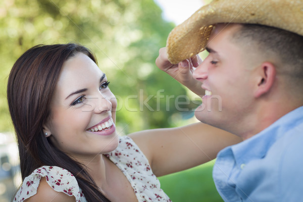 Métis romantique couple chapeau de cowboy flirt parc Photo stock © feverpitch
