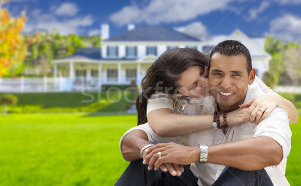 Happy Hispanic Young Couple in Front of Their New Home Stock photo © feverpitch