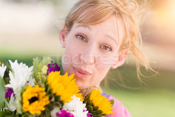 Outdoor Portrait of an Excited Young Adult Brown Eyed Woman Hold Stock photo © feverpitch