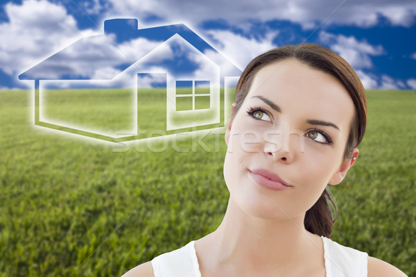 Woman and Grass Field with Ghosted House Figure Behind Stock photo © feverpitch