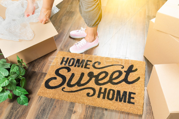 Woman in Pink Shoes and Sweats Unpacking Near Home Sweet Home We Stock photo © feverpitch