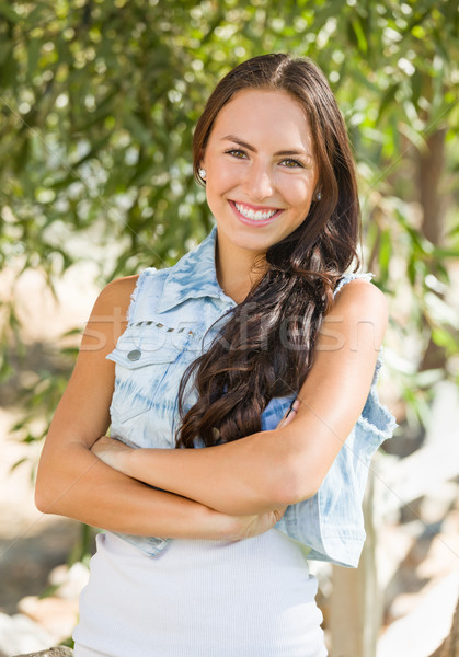 Attractive Smiling Mixed Race Girl Portrait Outdoors Stock photo © feverpitch