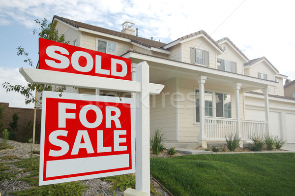 Sold Home For Sale Sign and New Home Stock photo © feverpitch