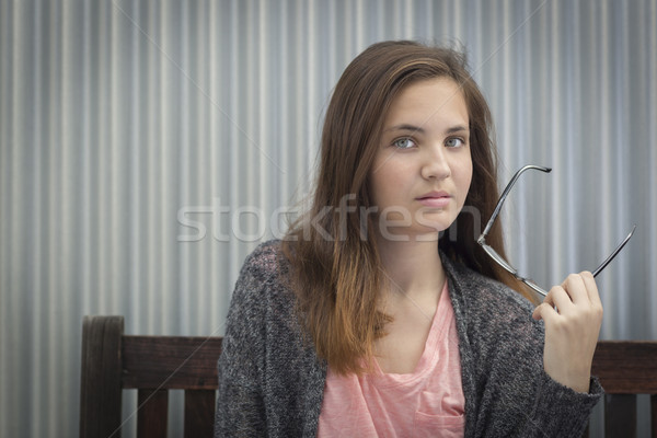 Retrato melancolía joven gafas sesión banco Foto stock © feverpitch