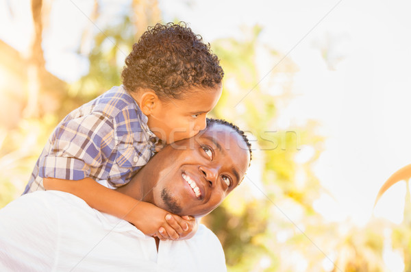 Mixed Race Son and African American Father Playing Outdoors Toge Stock photo © feverpitch