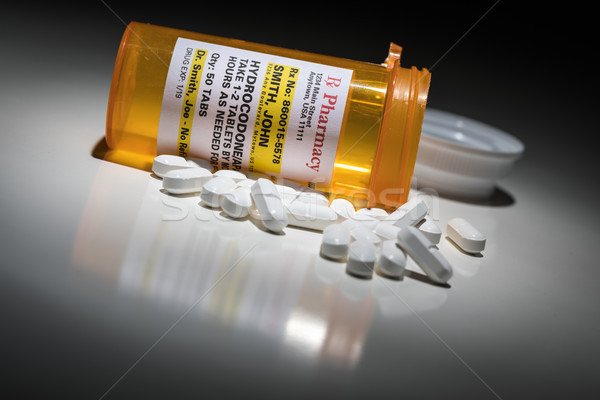 Hydrocodone Pills and Prescription Bottle with Non Proprietary L Stock photo © feverpitch