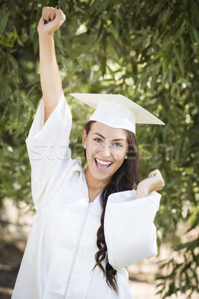 Happy Graduating Mixed Race Girl In Cap and Gown Stock photo © feverpitch